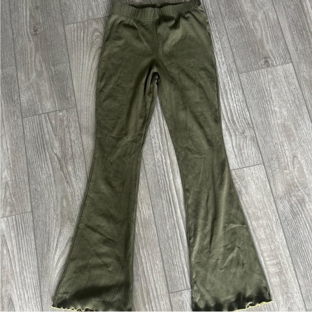 Green flared leggings
